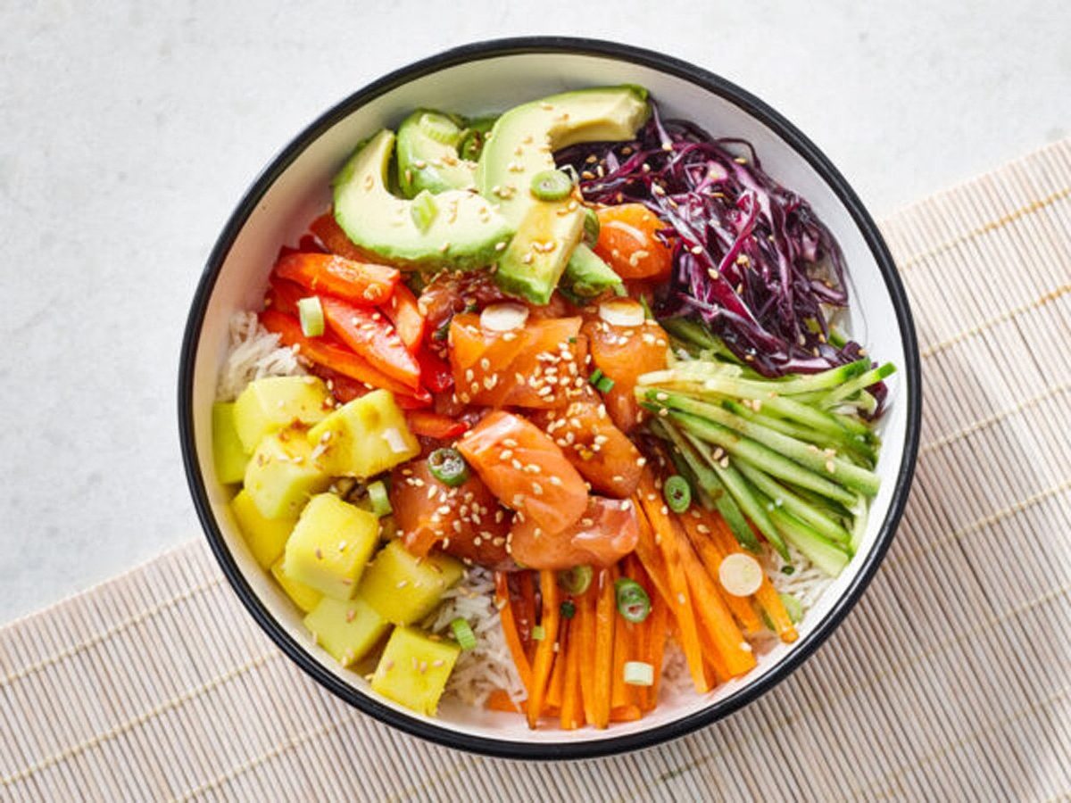 Poke bowl with salmon, tuna, mango, avocado and edamame